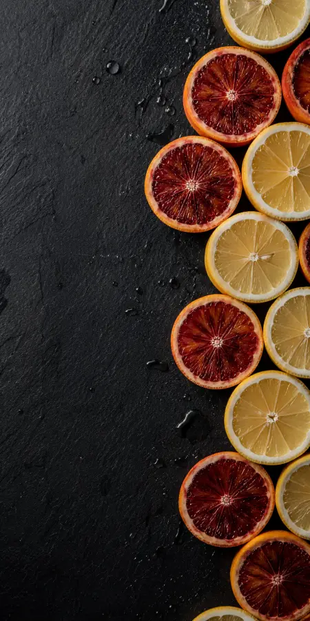 “Bold citrus vibes on a dark canvas.” 4K wallpaper for desktop and mobile - Pixbee