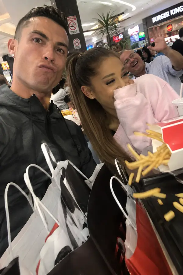 “Cristiano Ronaldo and Ariana Grande trying to survive fast food while one random uncle photobombs the multiverse.” 4K wallpaper for desktop and mobile - Pixbee
