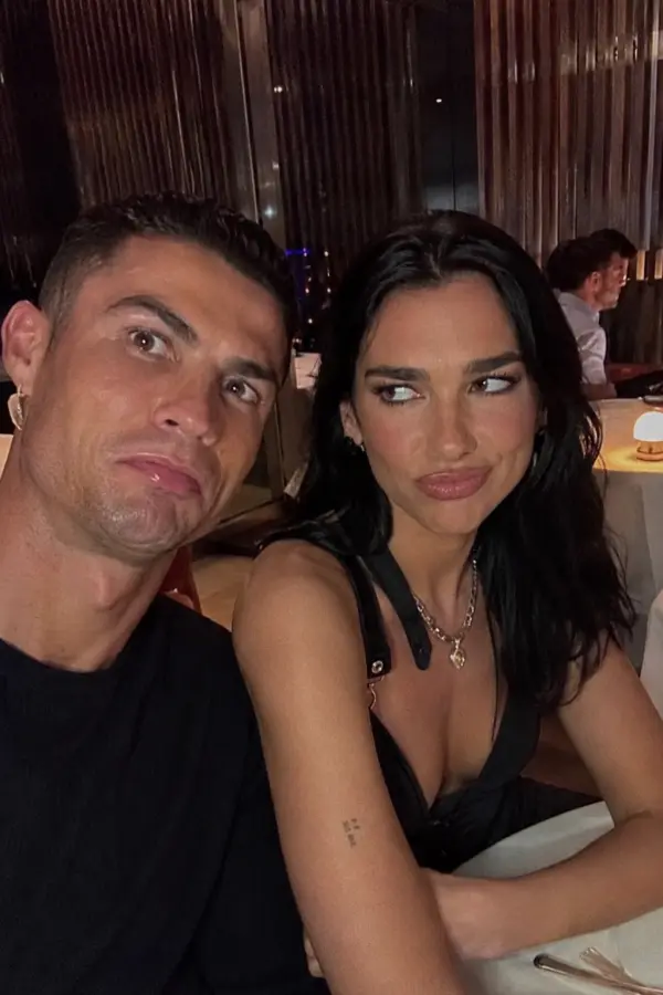 “Cristiano Ronaldo making a meme face while Dua Lipa questions every decision that led to this dinner.” 4K wallpaper for desktop and mobile - Pixbee
