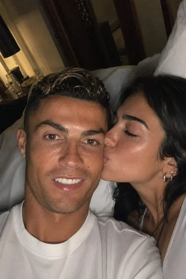 “Cristiano Ronaldo smiling for the selfie while Dua Lipa sneaks in a surprise kiss.” 4K wallpaper for desktop and mobile - Pixbee