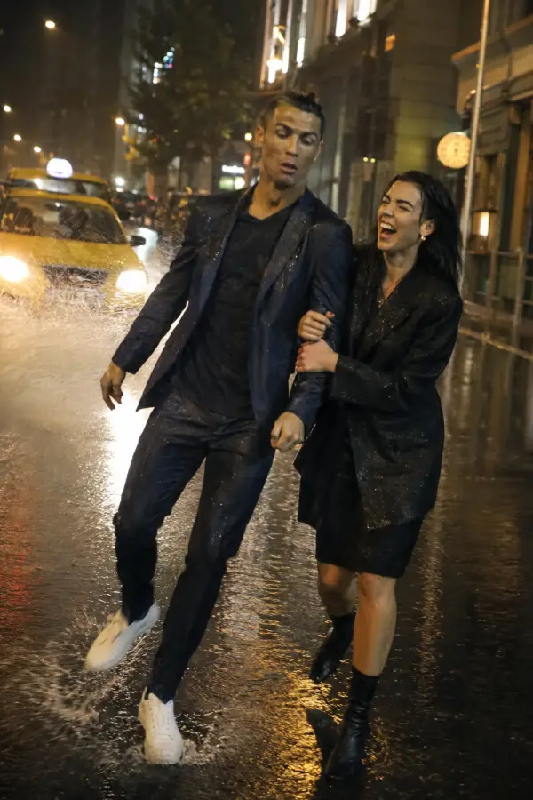“Cristiano Ronaldo trying to walk cool in the rain while the universe keeps adding splash sound effects.” 4K wallpaper for desktop and mobile - Pixbee