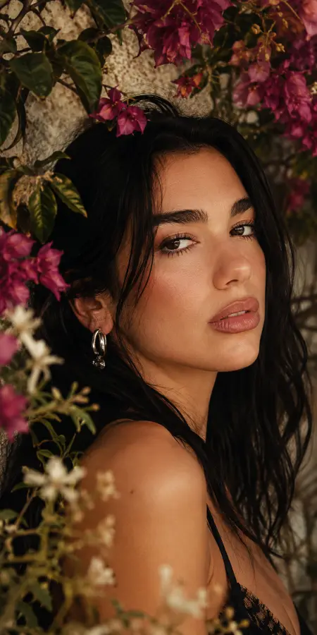 Dua Lipa Posing with Pink Flowers 4K wallpaper for desktop and mobile - Pixbee