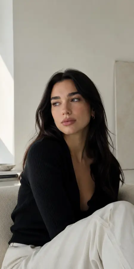 Dua Lipa Sitting in Black Cardigan 4K wallpaper for desktop and mobile - Pixbee