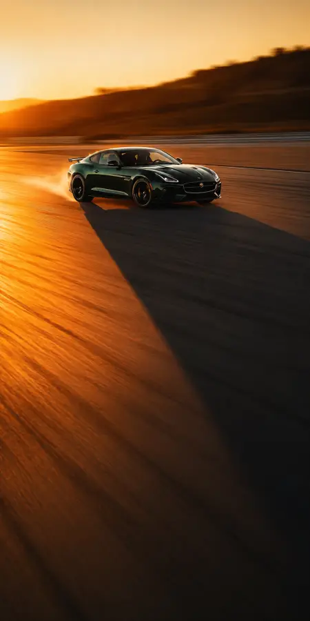 Green Jaguar F Type On Sunset Racetrack — cars phone wallpaper
