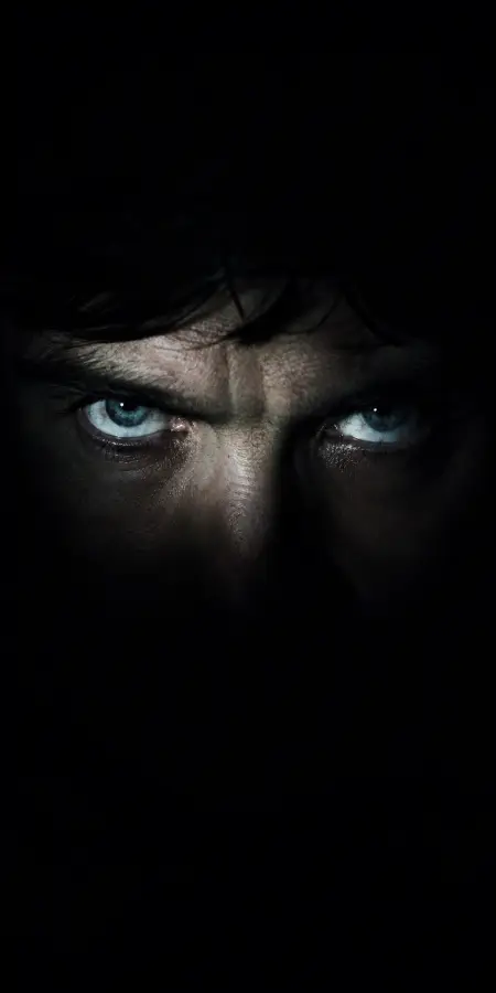 Intense Blue Eyes Looking Out From Darkness 4K wallpaper for desktop and mobile - Pixbee