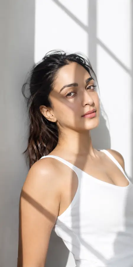 Kiara Advani In Sunlight Shadow Portrait 4K wallpaper for desktop and mobile - Pixbee