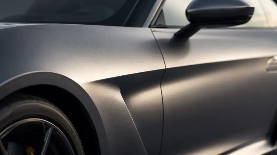 Macro Side Profile View of Matte Grey Textured Car Fender and Side Mirror 4K wallpaper for desktop and mobile - Pixbee
