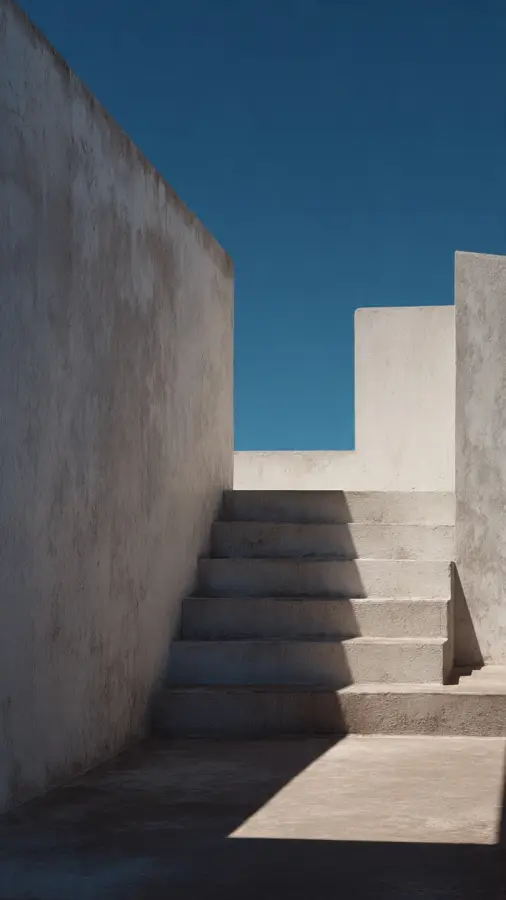 Minimalist Concrete Stairs Under Clear Blue Sky 4K wallpaper for desktop and mobile - Pixbee