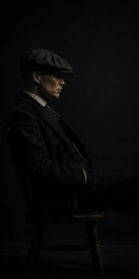 Moody Side Profile Portrait Sitting In Chair 4K wallpaper for desktop and mobile - Pixbee