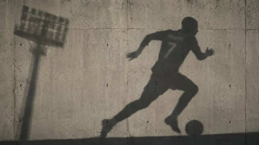 Running Footballer Shadow on Concrete Wall 4K wallpaper for desktop and mobile - Pixbee