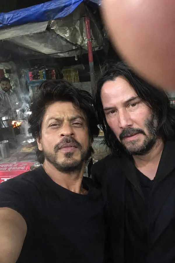 “Shah Rukh Khan and Keanu Reeves looking like they’re about to order chai… and eliminate the entire mafia afterward.” 4K wallpaper for desktop and mobile - Pixbee