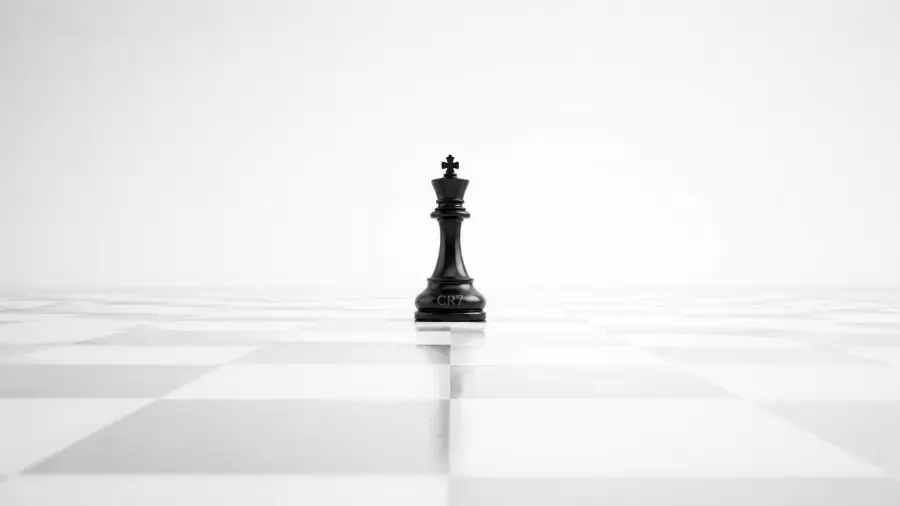 Single Black Chess King with CR7 Inscription on a Vast White Board 4K wallpaper for desktop and mobile - Pixbee