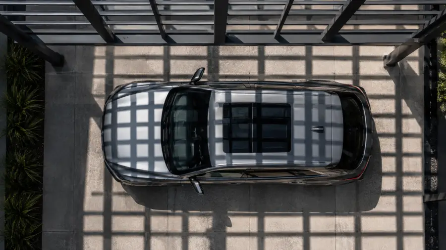 Top Down Overhead View of a Grey SUV Parked Under a Grid Pergola 4K wallpaper for desktop and mobile - Pixbee